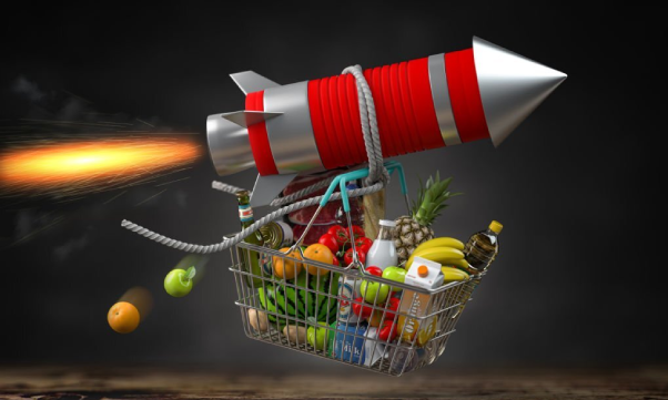 Shopping basket with food on a flying rocket of inflation.