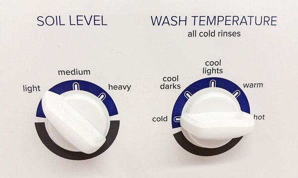 Soil level & wash temperature knobs on a washing machine.