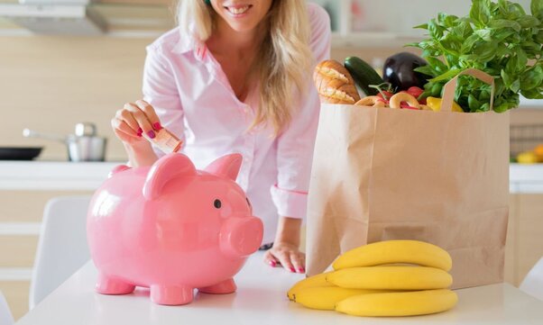 A woman saves money by shopping smarter.