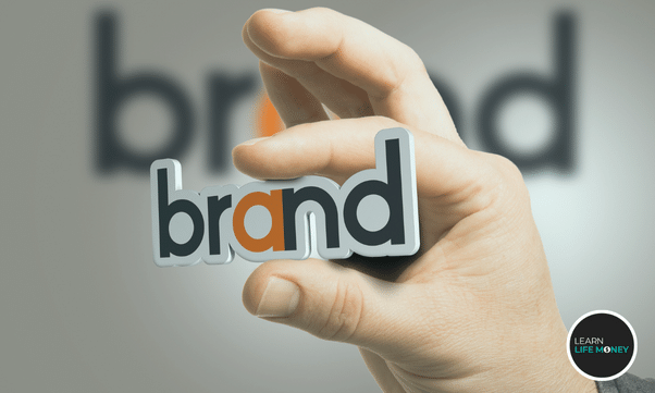 A hand holding "brand"